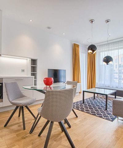 two-chairs-with-glass-table-on-living-room-near-window two-chairs-with-glass-table-on-living-room-near-window